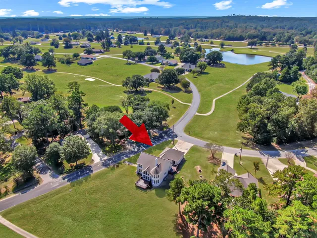 a view of a swimming pool with a yard