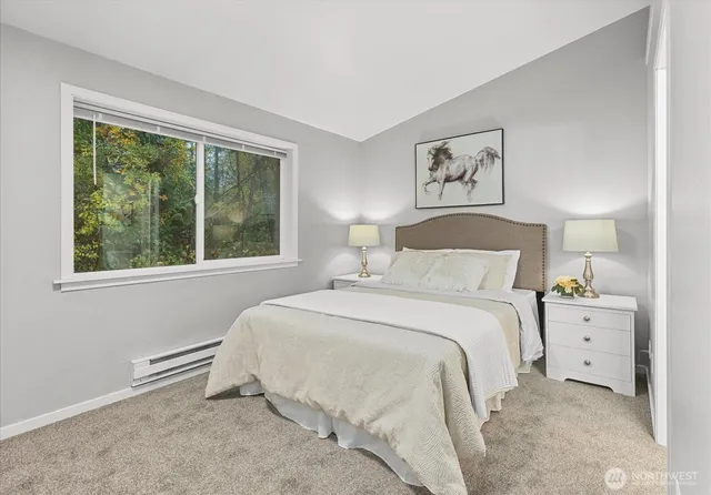 a bedroom with a bed and hallway