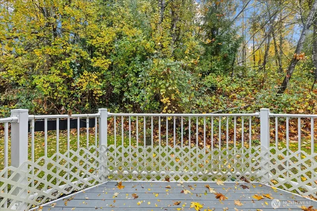 a front view of a house with sitting area and swimming pool