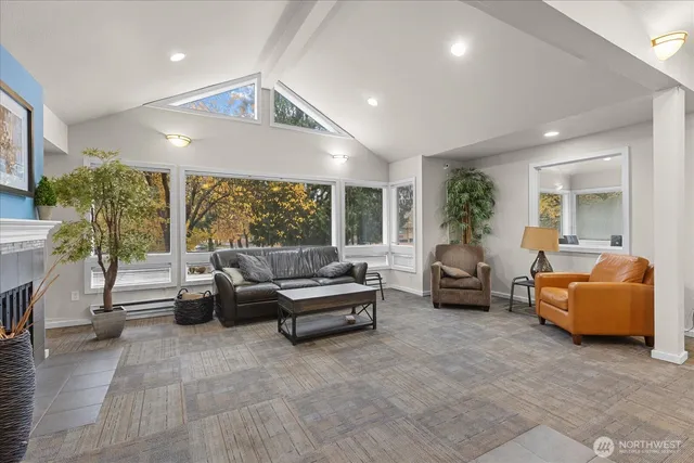 a dining room with furniture and window