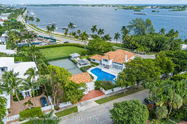 an aerial view of a house with a garden and swimming pool