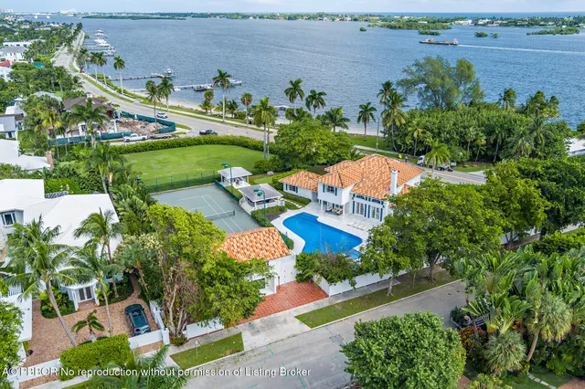 an aerial view of a house with a garden and swimming pool