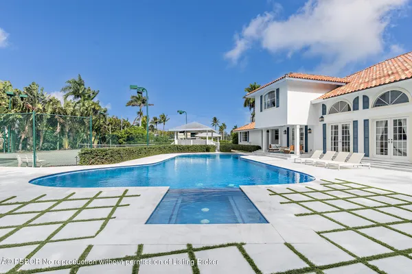 a view of a swimming pool with a lounge chairs