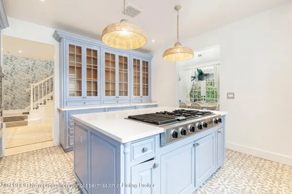 a kitchen with a stove and a sink