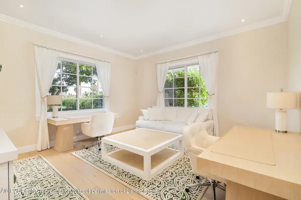 a living room with a window and a table