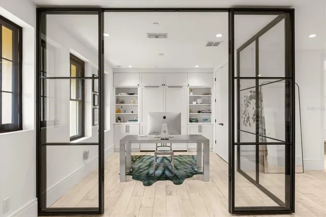 a view of a livingroom with furniture and a flat screen tv