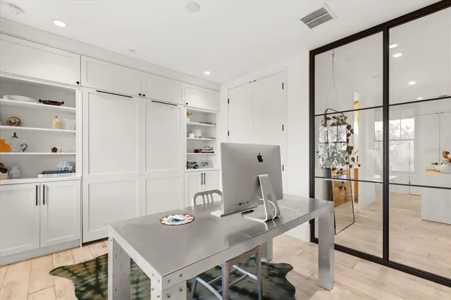 an aerial view of a residential houses with outdoor space