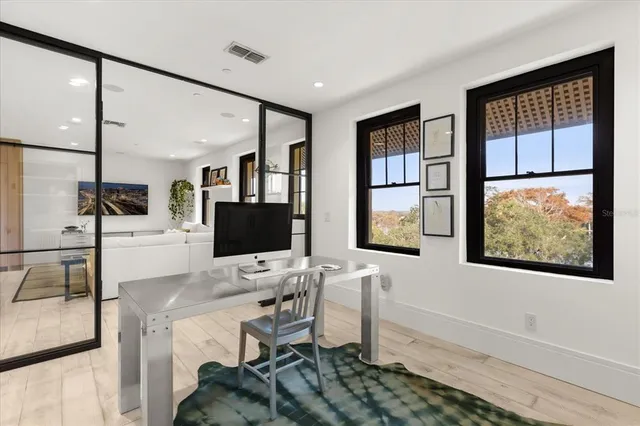 a view of a swimming pool with a yard and sitting space