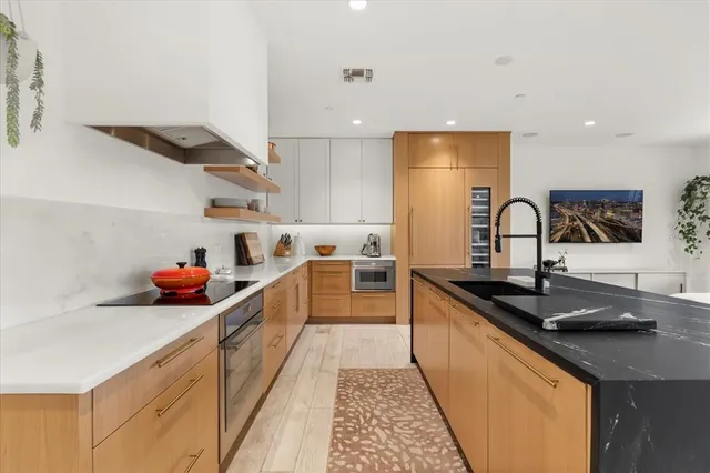 a bedroom with a large bed and a lamp