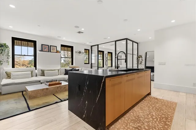 a bedroom with a bed and a dresser in it