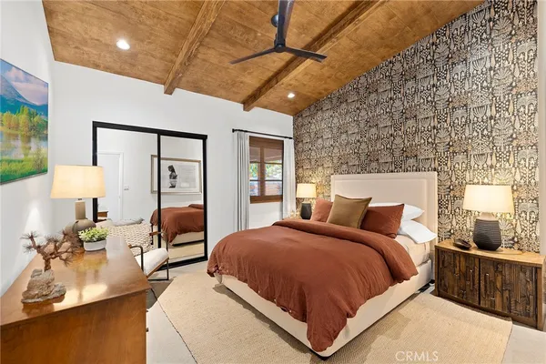 a bedroom with bed and window