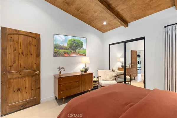 a bedroom with bed and window