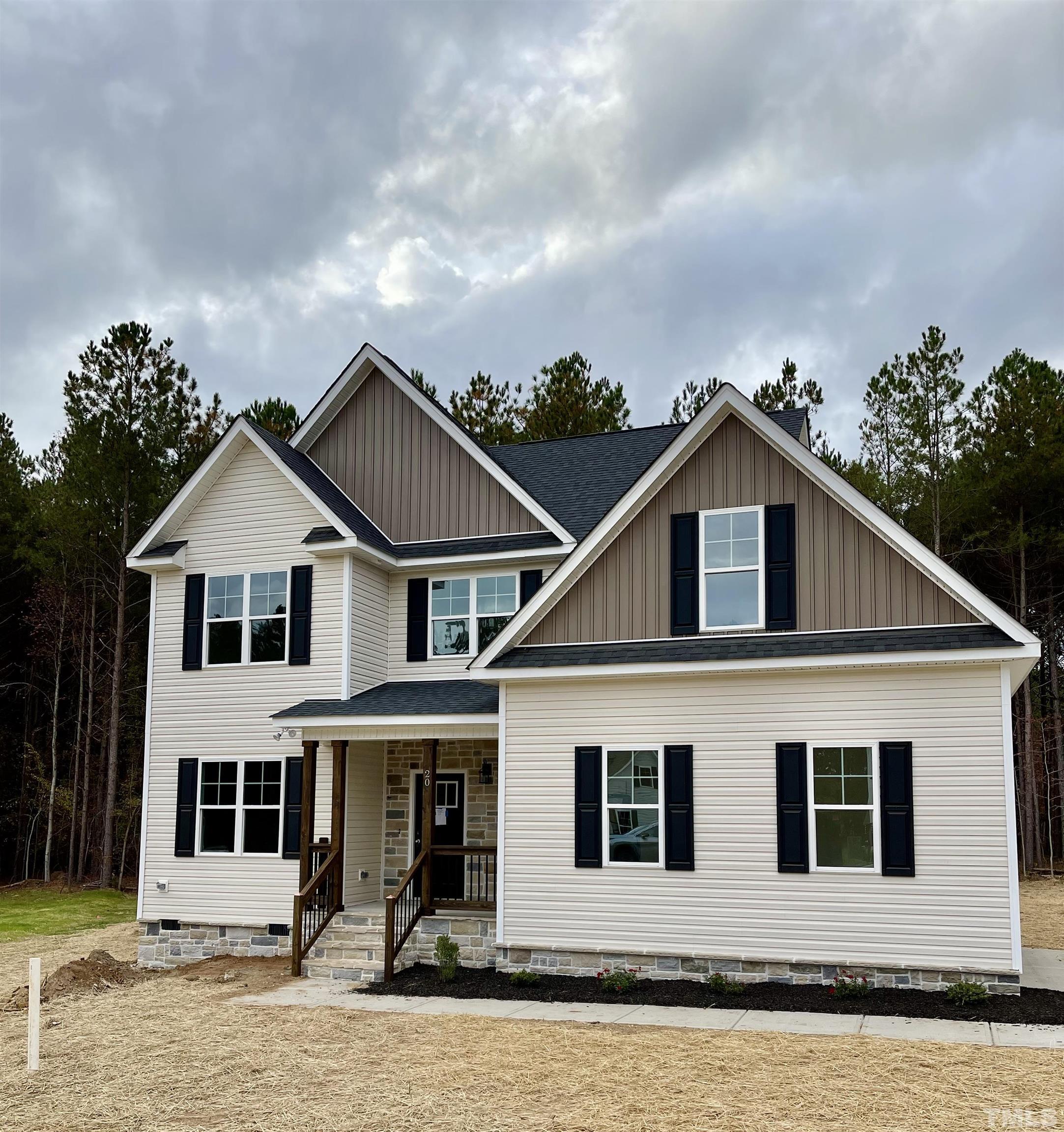 20 Mulberry Pl Spring Spring Hope, NC 27882 - Photo 1 of 18 a front view of a house with garden