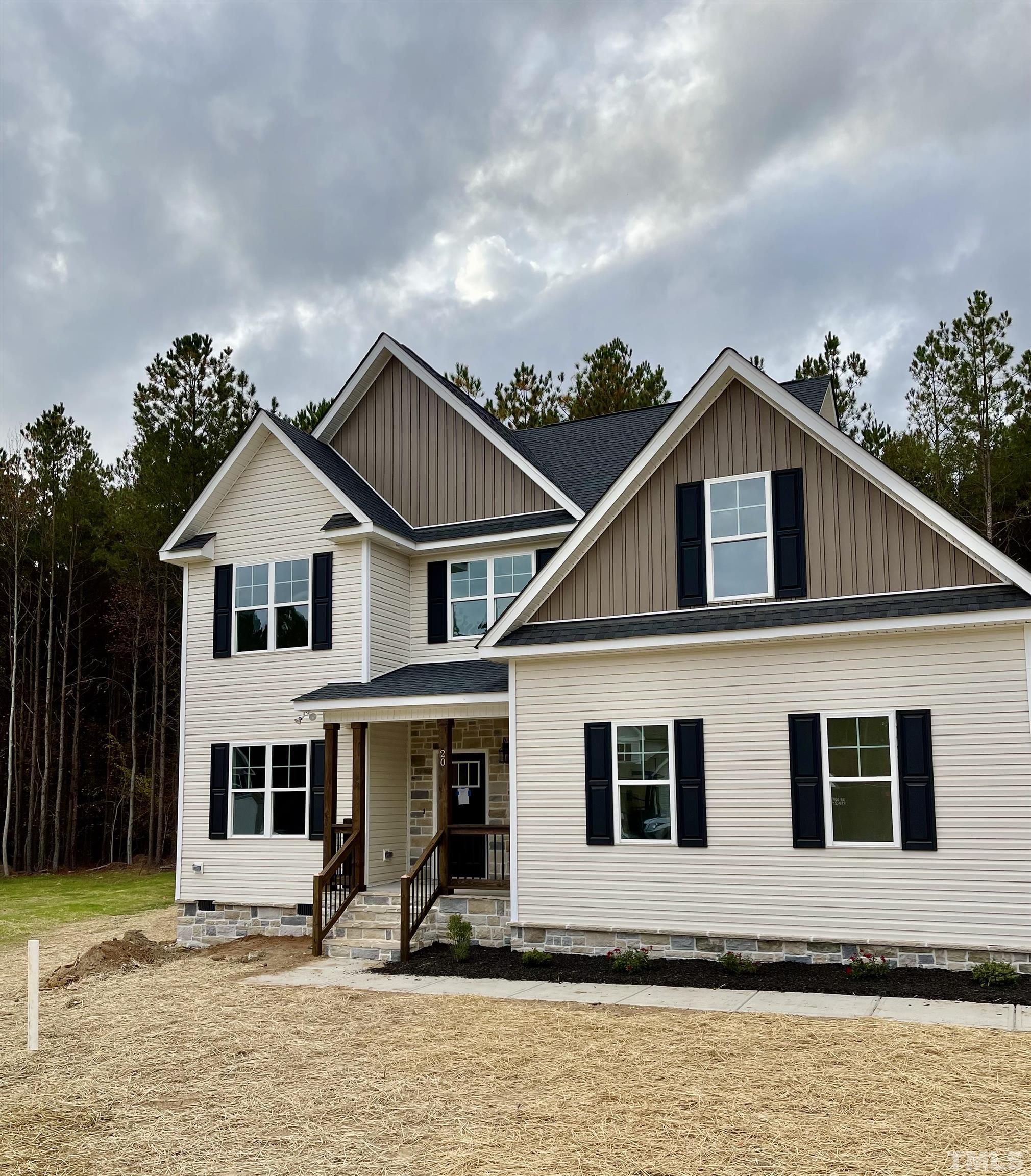 20 Mulberry Pl Spring Spring Hope, NC 27882 - Photo 2 of 18 a front view of a house with a yard