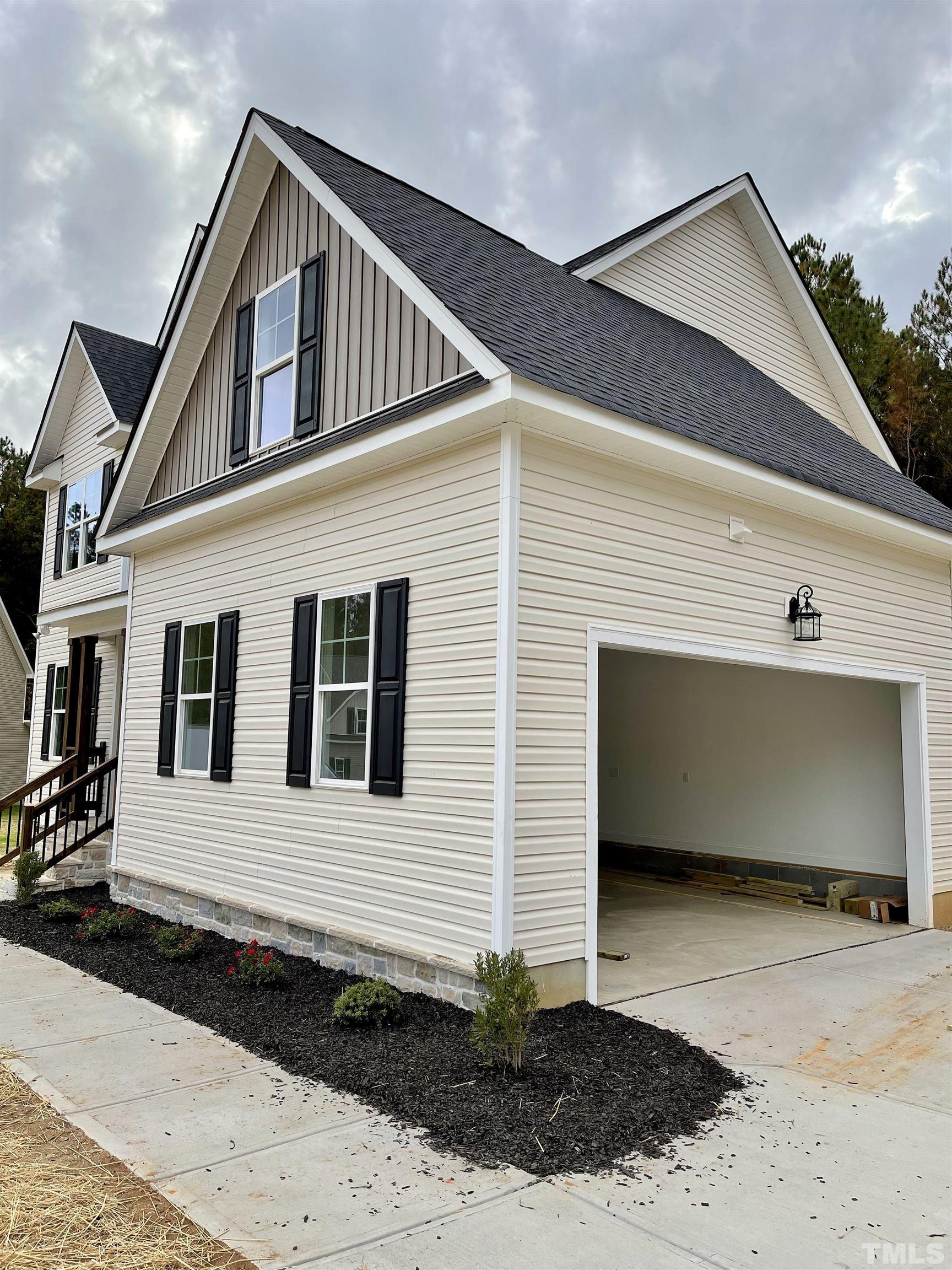 20 Mulberry Pl Spring Spring Hope, NC 27882 - Photo 4 of 18 a front view of a house with a yard