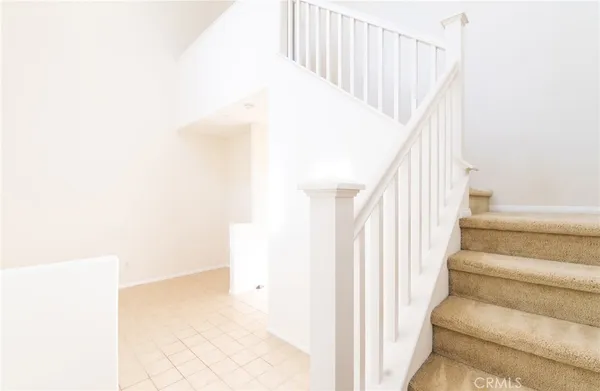 a view of staircase with white walls and white walls