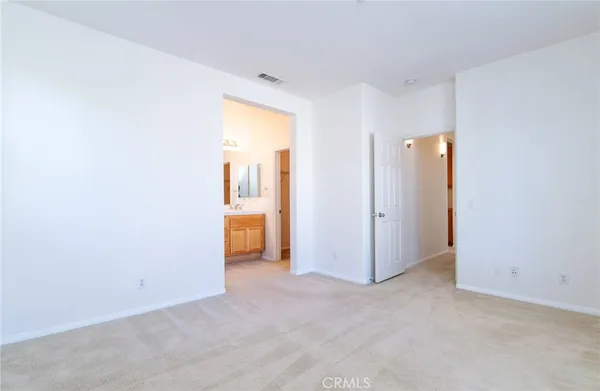 an empty room with a bathroom