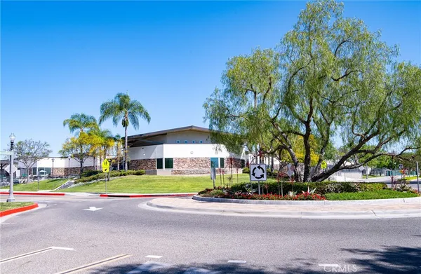 a view of a house with a yard porch and sitting area