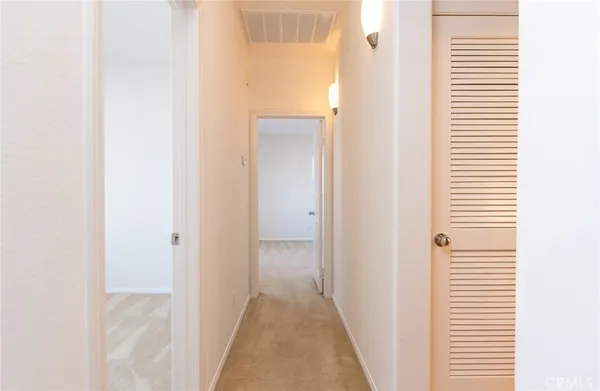 a view of a bathroom from a hallway