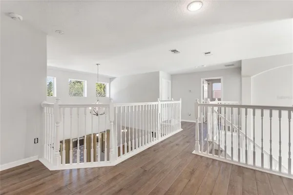 a view of entryway with wooden floor