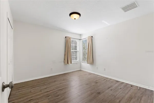 a view of entryway with wooden floor