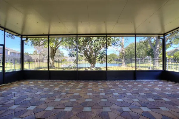 a view of empty room with large windows
