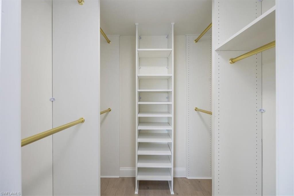 4150 Crayton Road, Unit B2 Naples, FL 34103 - Photo 12 of 23 a view of walk in closet with empty racks