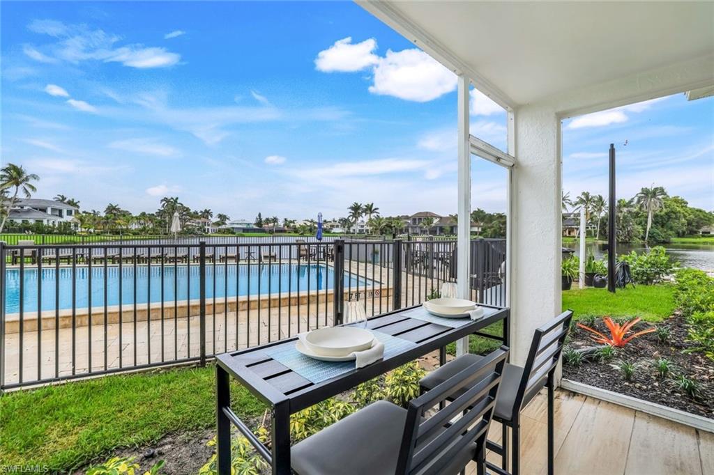 4150 Crayton Road, Unit B2 Naples, FL 34103 - Photo 15 of 23 a view of a balcony with furniture