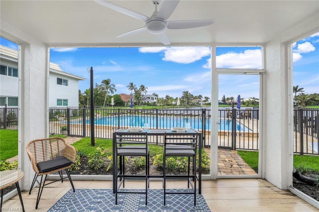 4150 Crayton Road, Unit B2 Naples, FL 34103 - Photo 16 of 23 a garden view with a seating space