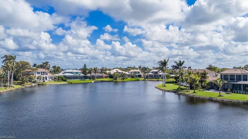 4150 Crayton Road, Unit B2 Naples, FL 34103 - Photo 19 of 23 a view of a lake with houses