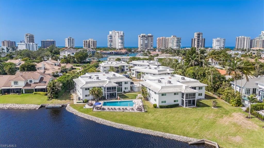 4150 Crayton Road, Unit B2 Naples, FL 34103 - Photo 21 of 23 a view of a city with tall buildings