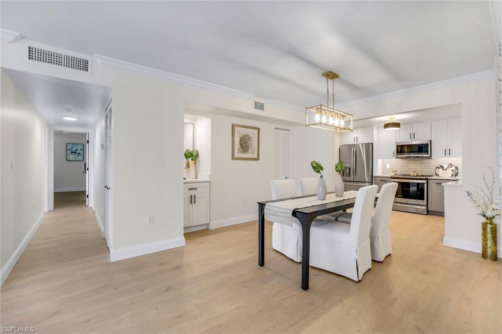 4150 Crayton Road, Unit B2 Naples, FL 34103 - Photo 6 of 23 a view of kitchen with furniture and refrigerator