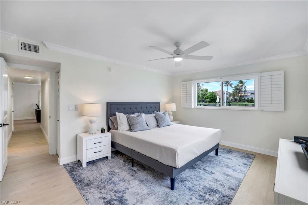 4150 Crayton Road, Unit B2 Naples, FL 34103 - Photo 8 of 23 a spacious bedroom with a bed and a window