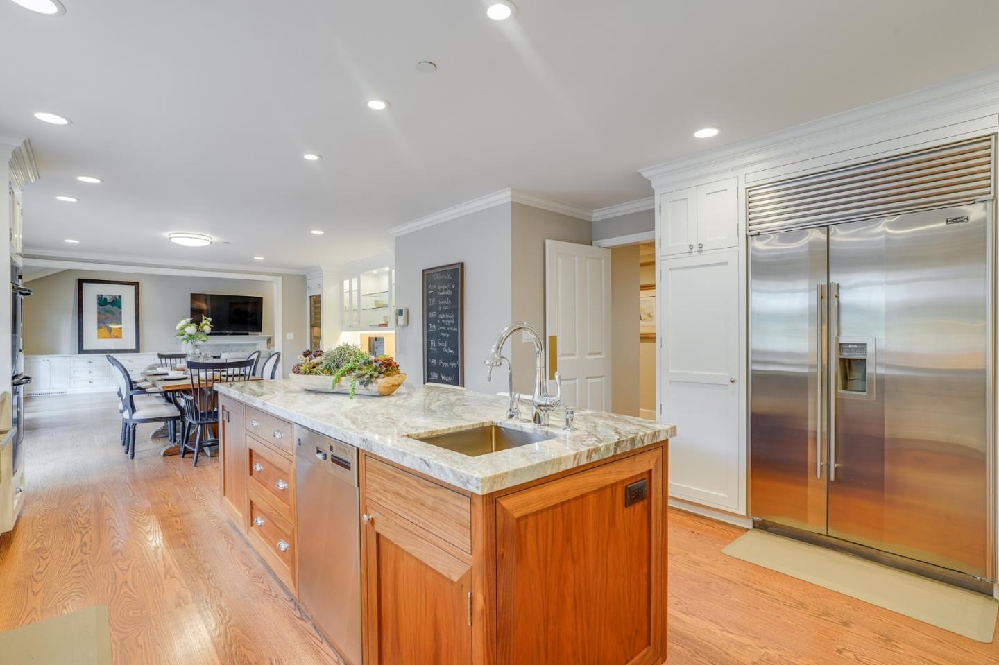 15 Joyce Road Hillsborough, CA 94010 - Photo 17 of 70 a kitchen with stainless steel appliances granite countertop a sink a stove a refrigerator and a view of living room