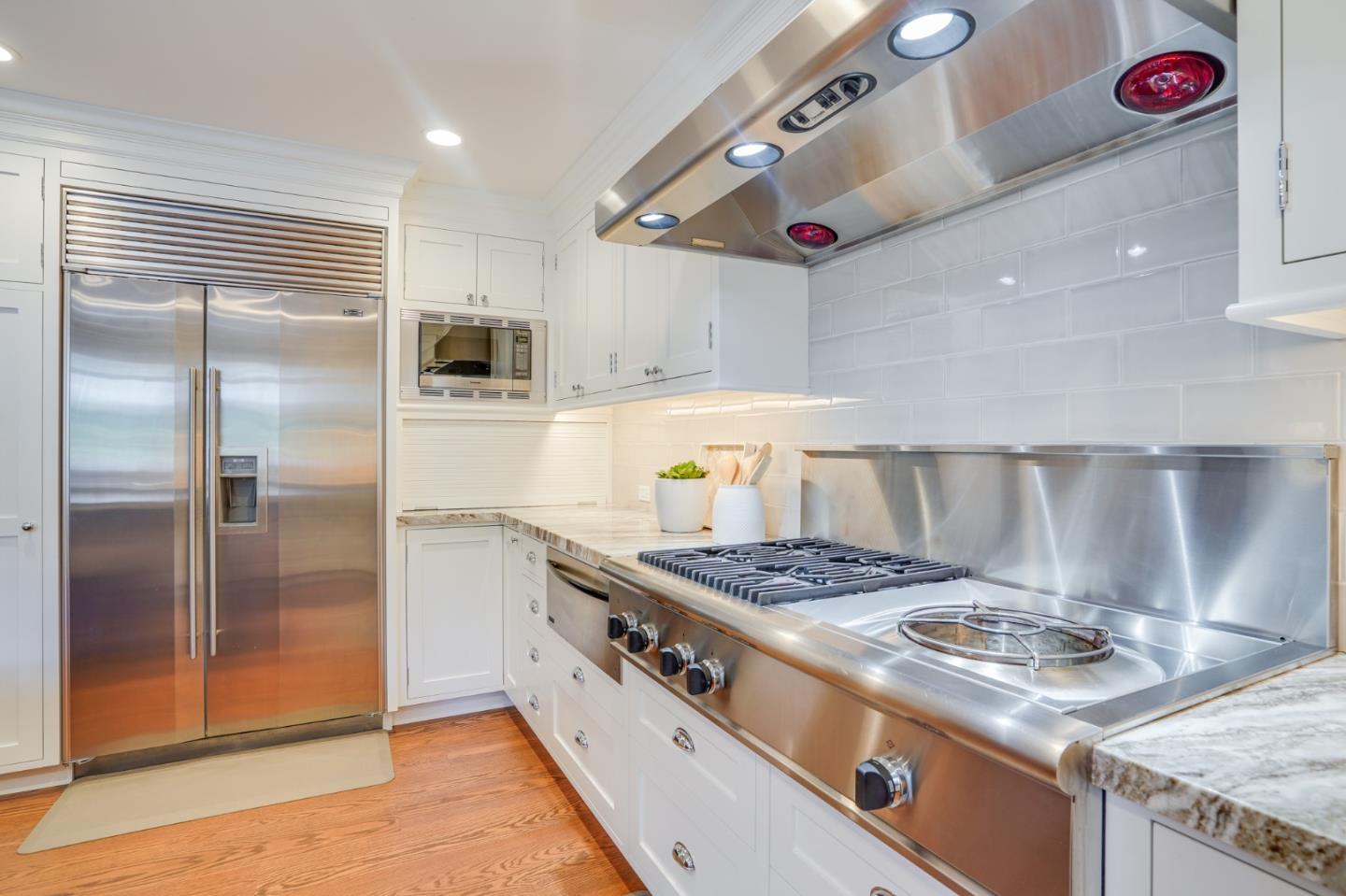 15 Joyce Road Hillsborough, CA 94010 - Photo 20 of 70 a kitchen with stainless steel appliances granite countertop a stove a refrigerator and a sink