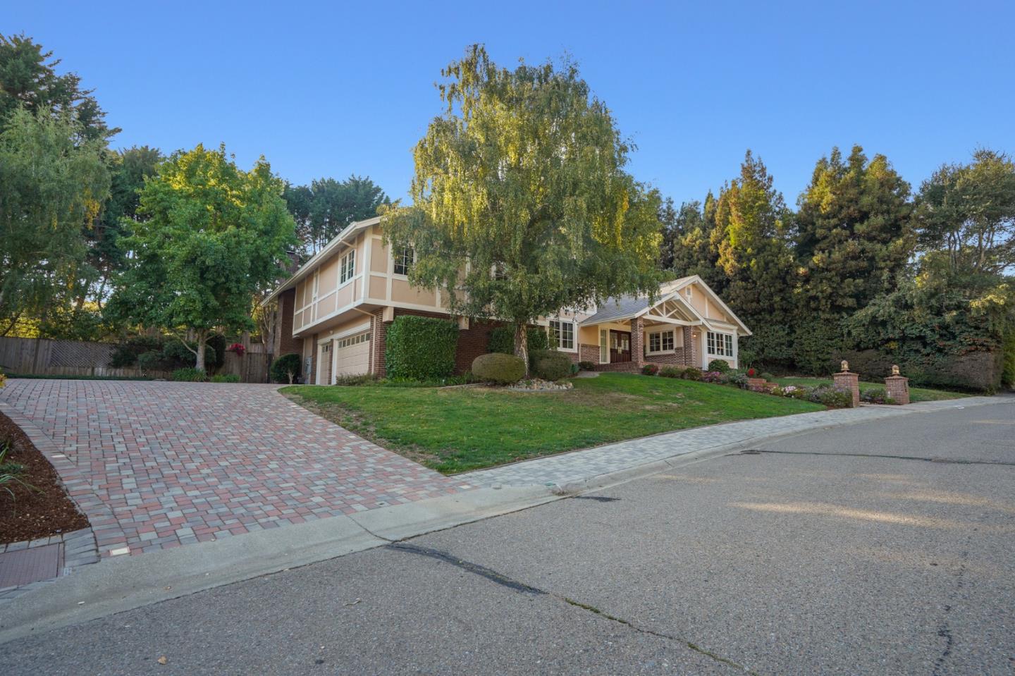 15 Joyce Road Hillsborough, CA 94010 - Photo 2 of 70 a yellow and red house with a yard