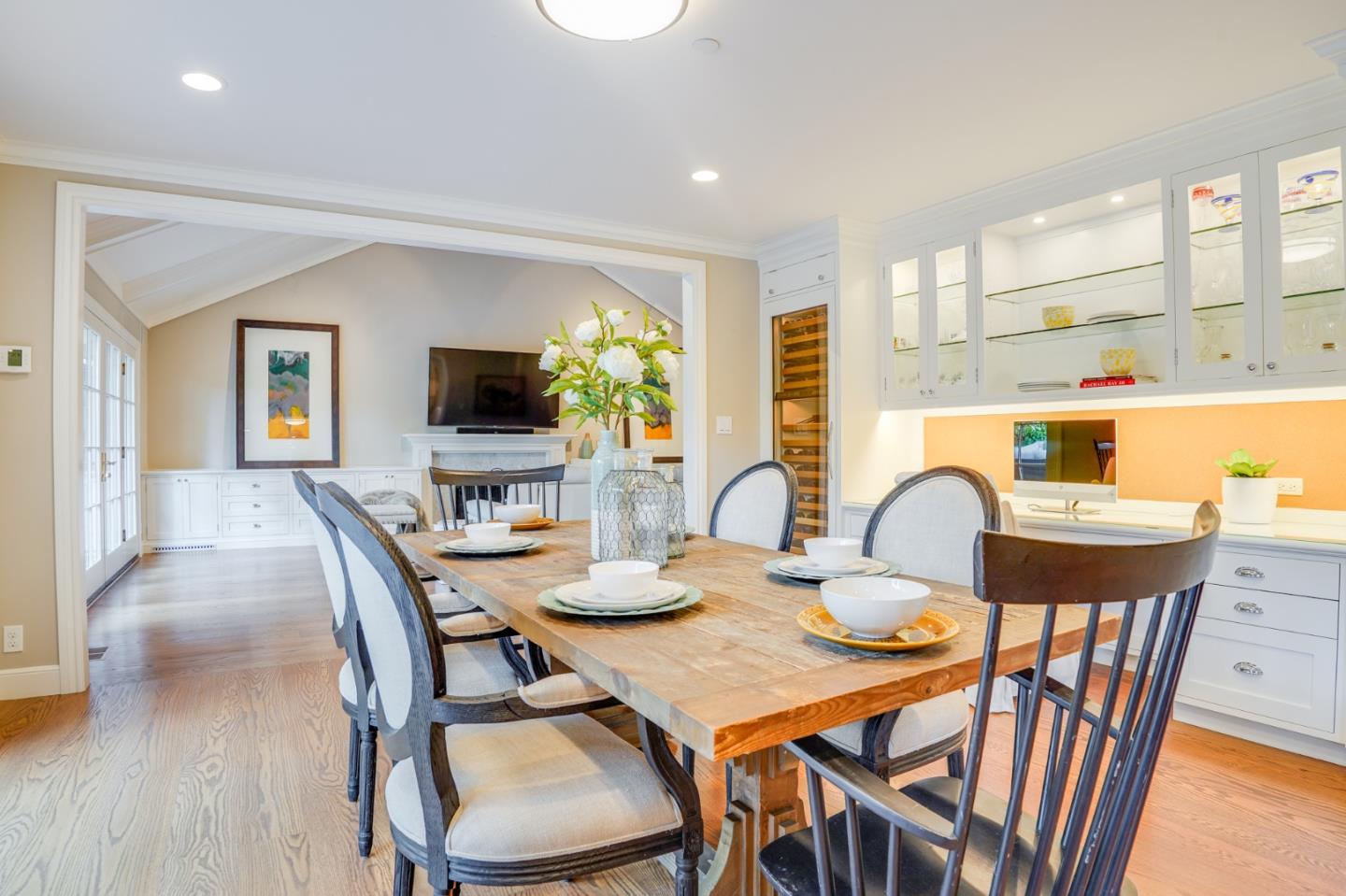15 Joyce Road Hillsborough, CA 94010 - Photo 25 of 70 a dining room with furniture a window and a flat screen tv