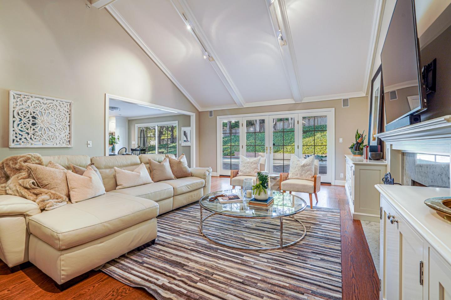15 Joyce Road Hillsborough, CA 94010 - Photo 27 of 70 a living room with furniture fireplace and flat screen tv