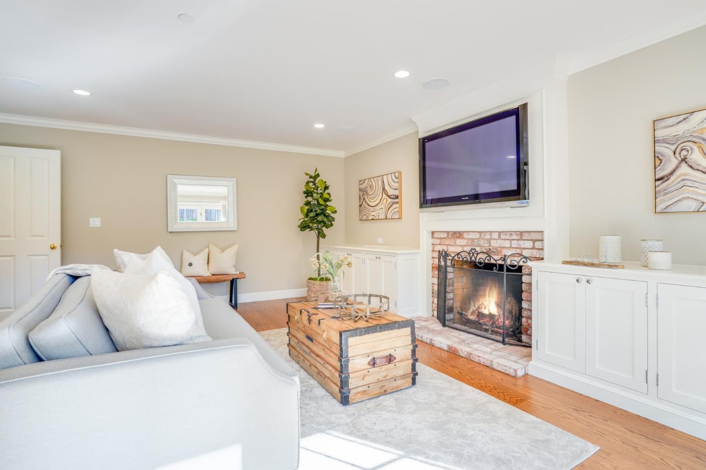 15 Joyce Road Hillsborough, CA 94010 - Photo 32 of 70 a living room with furniture and a fireplace