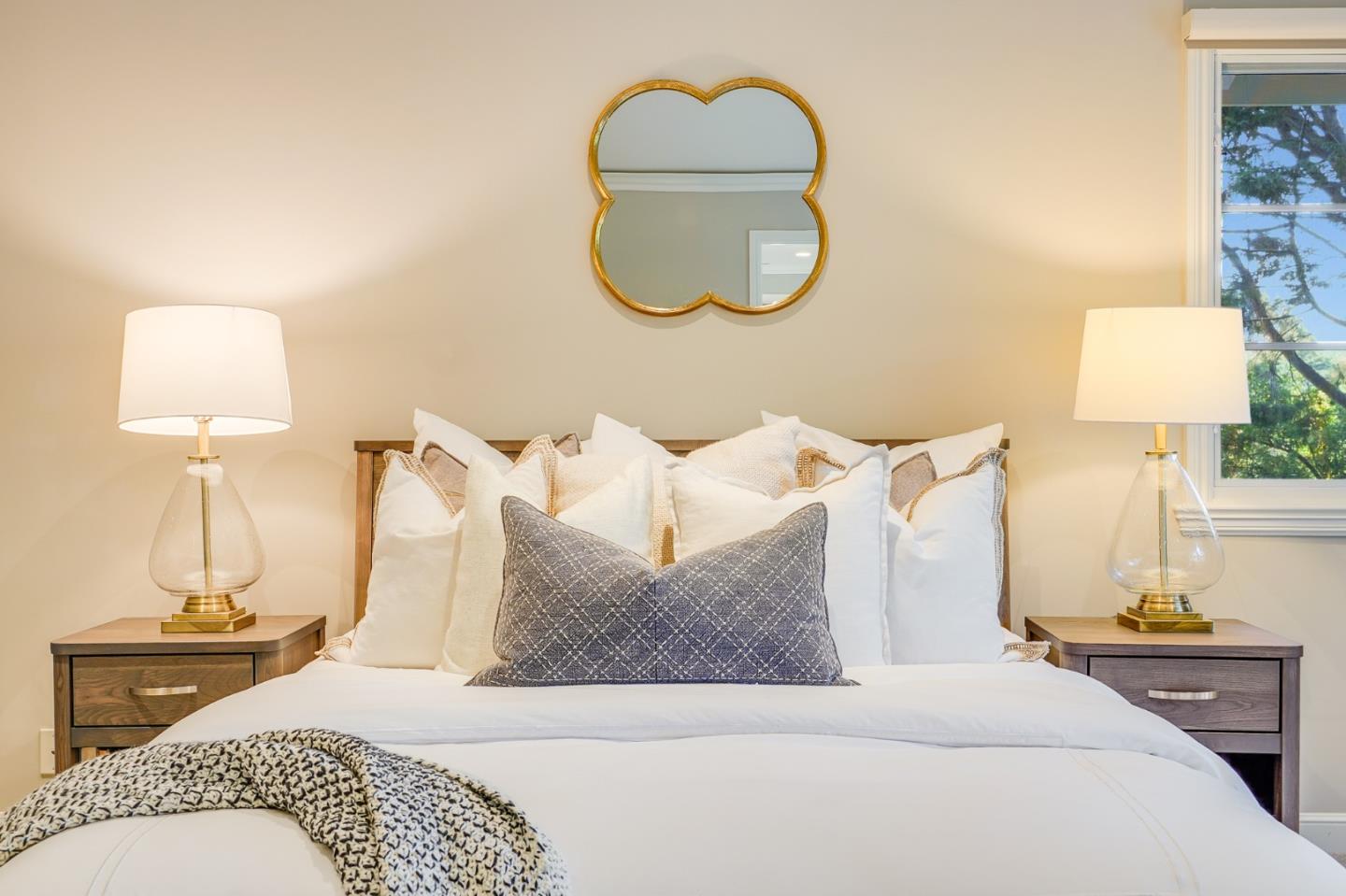 15 Joyce Road Hillsborough, CA 94010 - Photo 39 of 70 a bedroom with a bed and a lamp