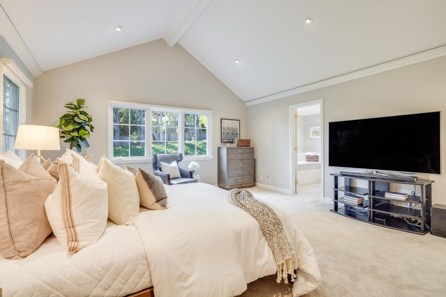 15 Joyce Road Hillsborough, CA 94010 - Photo 40 of 70 a bedroom with a bed and a flat screen tv