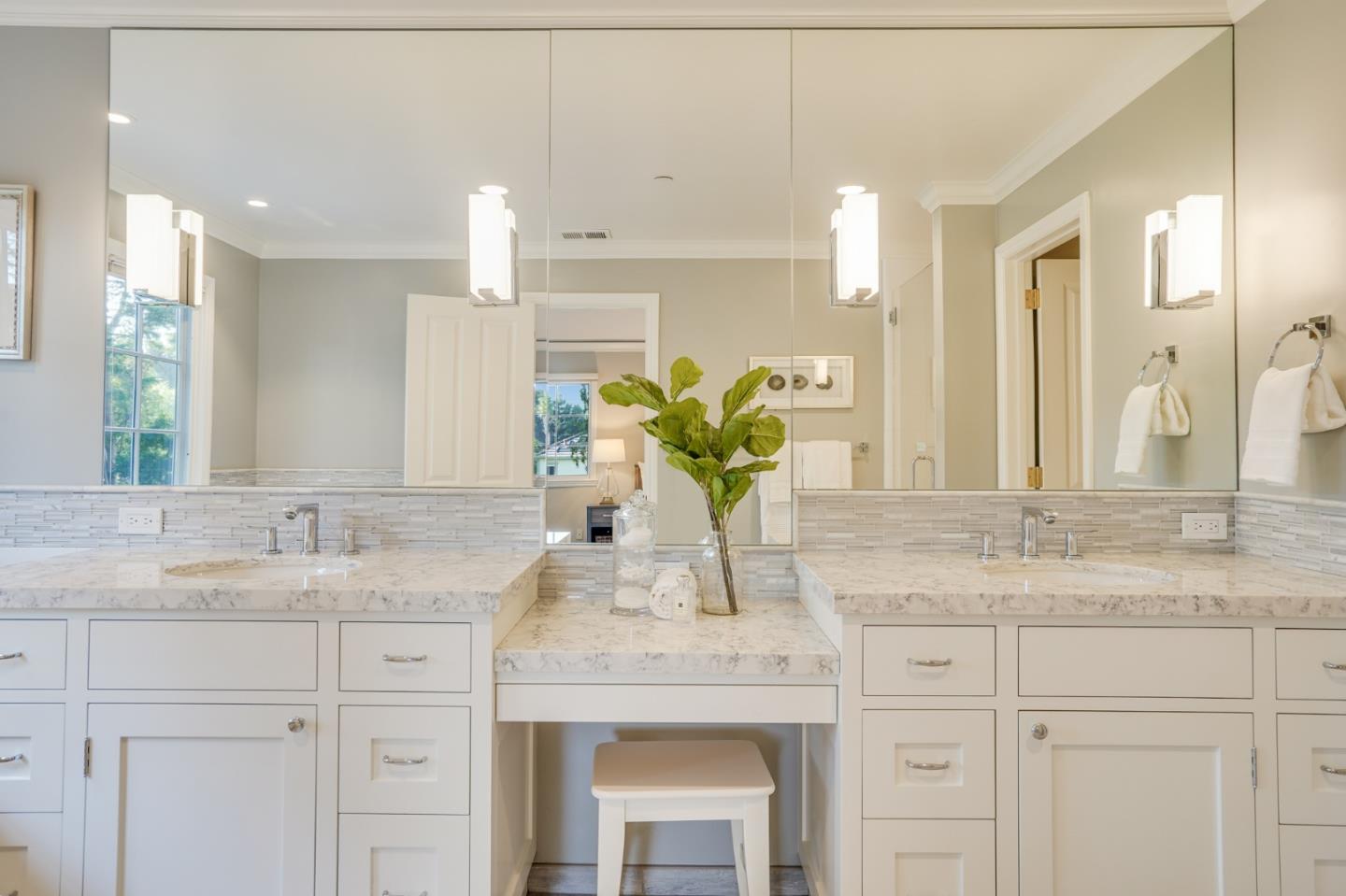 15 Joyce Road Hillsborough, CA 94010 - Photo 42 of 70 a bathroom with a granite countertop sink a potted plant and a large mirror