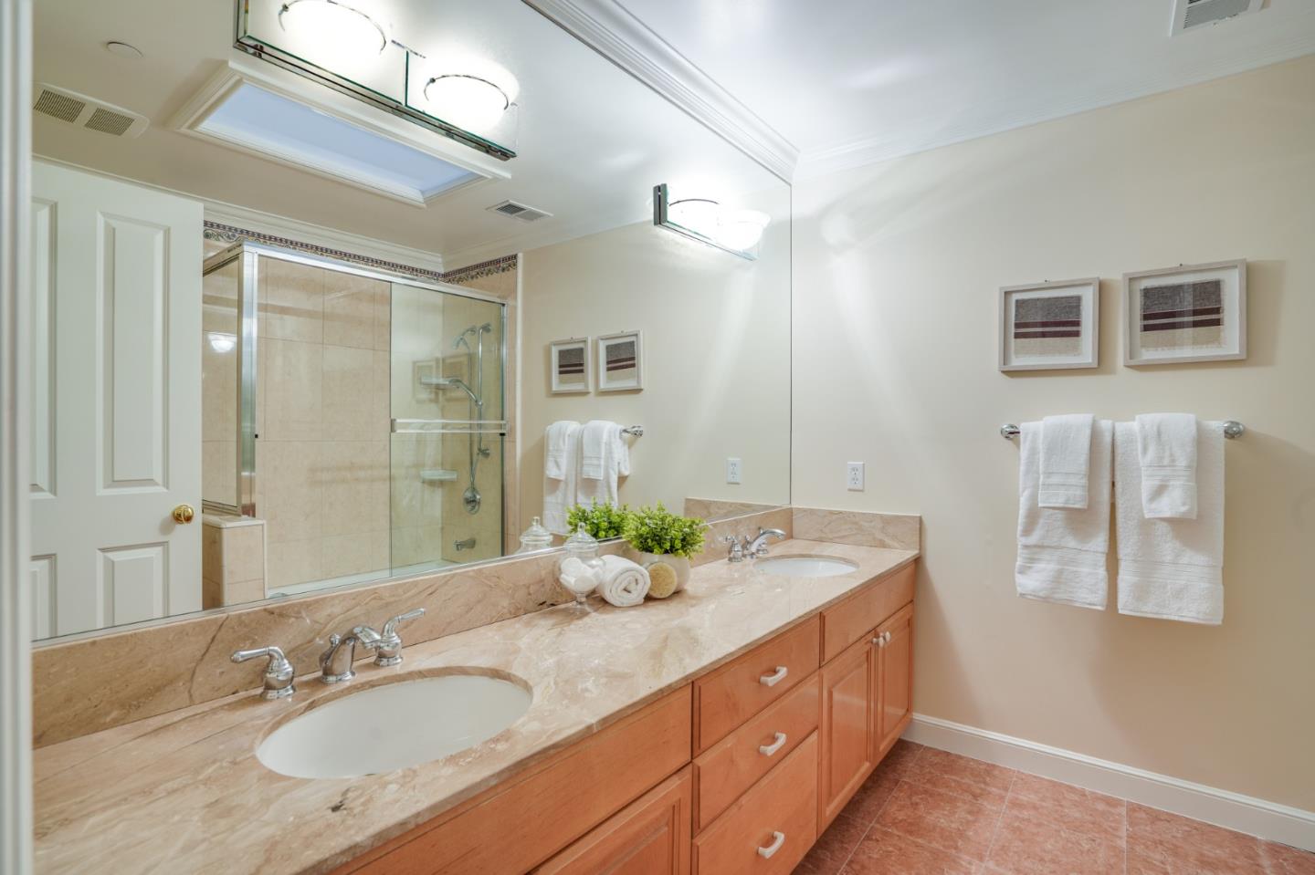 15 Joyce Road Hillsborough, CA 94010 - Photo 52 of 70 a bathroom with a granite countertop sink and a mirror