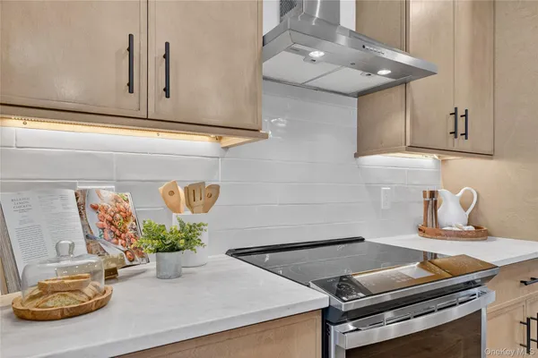 a kitchen with a sink and a stove top oven