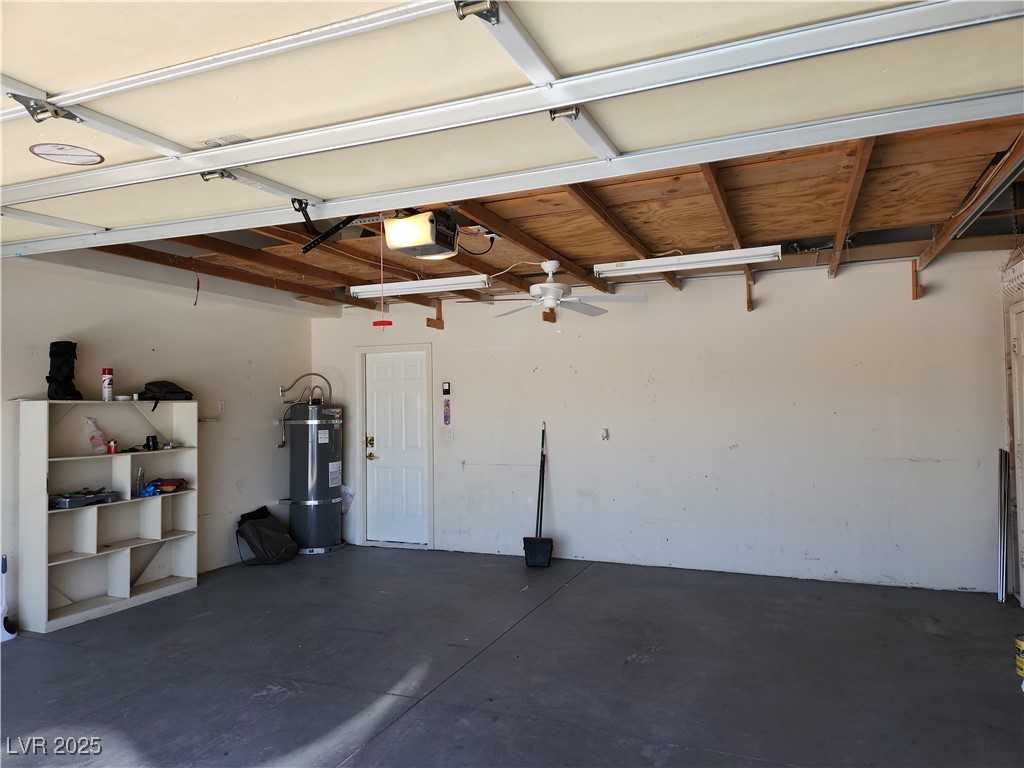 161 Diamond Bar Road Pahrump, NV 89048 - Photo 20 of 29 Garage featuring secured water heater and a garage door opener