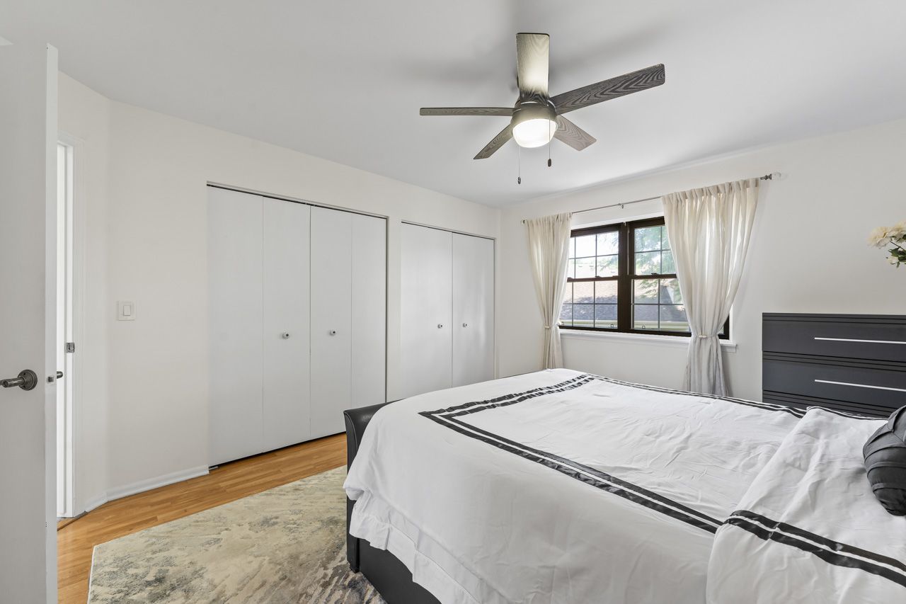 706 Brandon Place Wheeling, IL 60090 - Photo 28 of 42 a bedroom with a bed and a dresser
