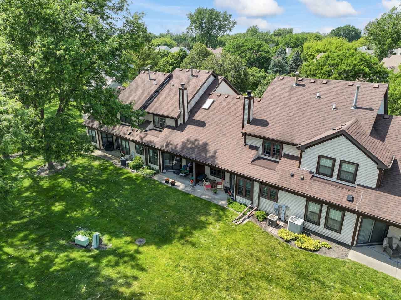 706 Brandon Place Wheeling, IL 60090 - Photo 38 of 42 an aerial view of a house with swimming pool and a yard