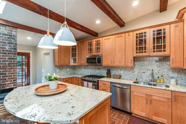 a kitchen with a sink and a table