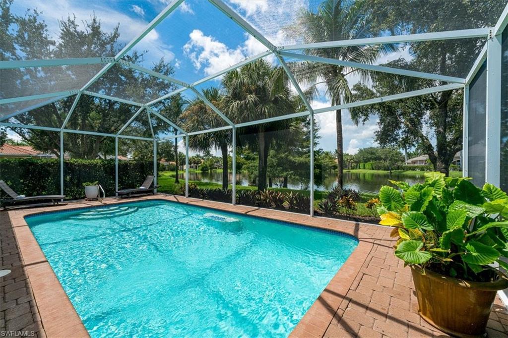 14291 Manchester Drive Naples, FL 34114 - Photo 13 of 49 a view of a backyard with garden and plants