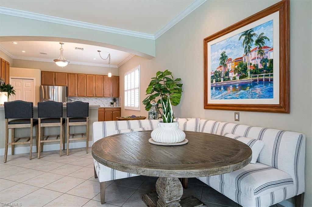 14291 Manchester Drive Naples, FL 34114 - Photo 14 of 49 a dining room with furniture and wooden floor